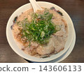 Soy sauce ramen topped with plenty of pork back fat and green onions. 143606133