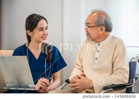 Asian woman doctor nursing holding clipboard with patients chart while talking and explain for results of treatment to patient old man sitting in wheelchair Asian woman doctor nursing holding clipboard with patients chart while talking and explain for results of treatment to patient old man sitting in wheelchair 143606926