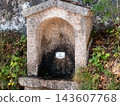 Traditional stone drinking water fountain outdoors 143607768