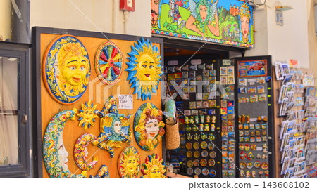 Cefalu, Italy. 21 August 2026. A Sicilian souvenir shop offering plenty of attractions for tourists. The Trinacria is the official symbol of Sicily. It depicts the head of Medusa surrounded by three Cefalu, Italy. 21 August 2026. A Sicilian souvenir shop offering plenty of attractions for tourists. The Trinacria is the official symbol of Sicily. It depicts the head of Medusa surrounded by three 143608102