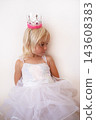 Little Blonde Girl Wearing Princess Crown and Dress Looking Down  143608383