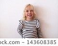 Happy Little Blonde Girl Smiling and Looking Away on White Background 143608385