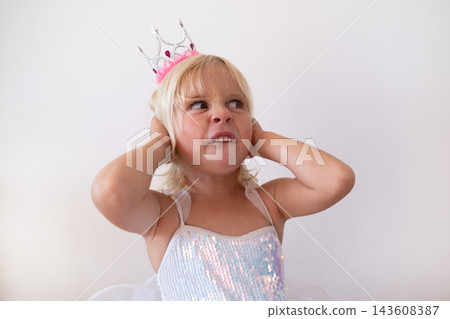 Disgusted Little Blonde Girl Wearing Princess Crown and Dress Pinching Nose Disgusted Little Blonde Girl Wearing Princess Crown and Dress Pinching Nose 143608387