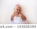 Little Blonde Girl Wearing Princess Crown and Dress on White Background 143608389