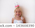Little Blonde Girl Wearing Princess Crown and Dress on White Background 143608390