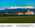 Autumn foliage scenery in Hokkaido, overlooking Asahikawa Airport and the Daisetsuzan mountain range. 143608471