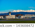 Autumn foliage scenery in Hokkaido, overlooking Asahikawa Airport and the Daisetsuzan mountain range. 143608472