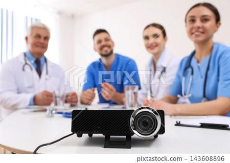 Video projector on table during medical conference Video projector on table during medical conference 143608896