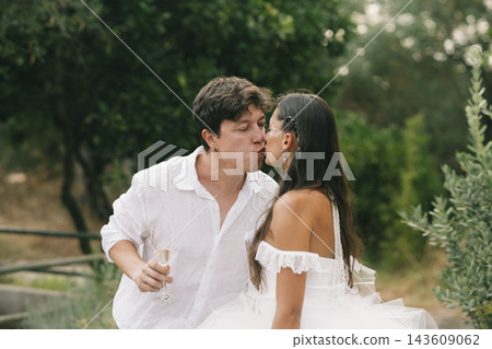 Bride And Groom Kissing Beside The Pool Bride And Groom Kissing Beside The Pool 143609062