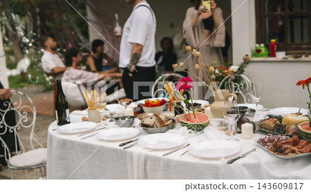 Guests Standing Beside A Wedding Reception Table Guests Standing Beside A Wedding Reception Table 143609817