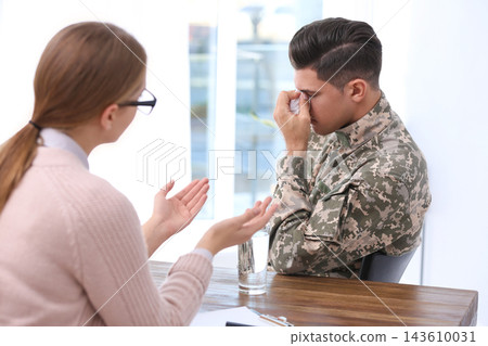 Psychotherapist working with military officer in office Psychotherapist working with military officer in office 143610031