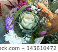 Autumn flower bouquet with ornamental brassica cabbage in craft paper wrap 143610472