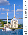 Ortakoy Mosque and Bosphorus Bridge Tower with Cruising Yacht 143610748
