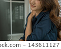 Asian businesswoman working on digital tablet with stylus outside modern building 143611127