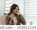 Asian businesswoman working on digital tablet with stylus outside modern building 143611134