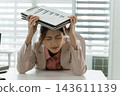 Asian businesswoman working on digital tablet with stylus outside modern building 143611139