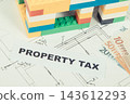 Inscription property tax, house made of colorful blocks, electrical installation plan and euro 143612293