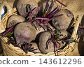 Vegetables in wicker basket on stand at bazaar. Food containing minerals and vitamins 143612296