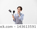 The image of a woman struggling in the kitchen 143613591