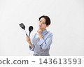 The image of a woman struggling in the kitchen 143613593