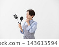 The image of a woman struggling in the kitchen 143613594