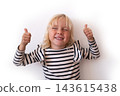 Little Blonde Girl Showing Thumbs Up Gesture with Closed Eyes  143615438