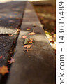 Autumn natural scenery: Colorful autumn leaves and fallen maple leaves scattered throughout the temple grounds. Autumn natural scenery: Colorful autumn leaves and fallen maple leaves scattered throughout the temple grounds. 143615489