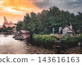 A cabin illuminated by the setting sun 143616163