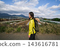 A woman hiking in the Shibusawa Hills 143616781