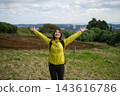 Female hiker relaxing in a hilly area 143616786