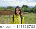 Portrait of a smiling woman hiking in the Shibusawa Hills 143616788