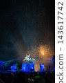 A large flower blooming in the night sky 143617742