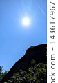Blue sky, sun, and rocks 143617967