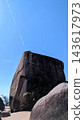 Contrails floating above rocks 143617973