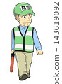 A male crime prevention volunteer walking with a traffic wand - 01 143619092