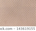 Close-up of a seamless light beige and brown woven texture background, featuring an intricate, repetitive interlaced pattern. Ideal for modern designs, backdrops, and material concepts. 143619155