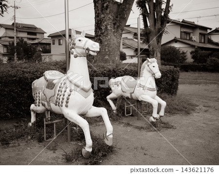 A carousel horse figurine in the park A carousel horse figurine in the park 143621176