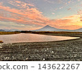 Mount Fuji and the sunrise as seen from the Fujikawa River 143622267