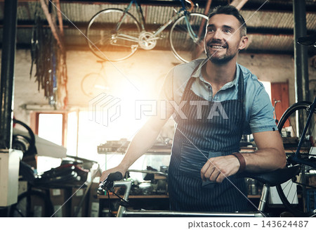 Happy, man and bicycle repair shop with mechanic, technician and maintenance work with pride. Workshop, service and business owner with startup, apron and bike for fixing with entrepreneur in garage 143624487