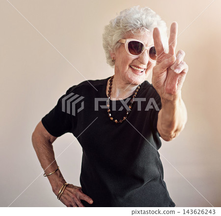 Senior, woman and fashion with peace sign by wall background of trendy sunglasses, stylish or cool aesthetic. Fun, female person and retirement with hand gesture, unique and designer eyewear Senior, woman and fashion with peace sign by wall background of trendy sunglasses, stylish or cool aesthetic. Fun, female person and retirement with hand gesture, unique and designer eyewear 143626243