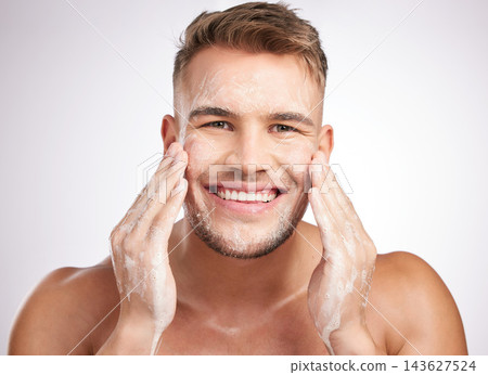 Man, skincare and cosmetic scrub for hygiene, anti aging and hydration for dermatology or wellness. Male person, beauty and results for face, cosmetology for self care in studio backdrop as routine Man, skincare and cosmetic scrub for hygiene, anti aging and hydration for dermatology or wellness. Male person, beauty and results for face, cosmetology for self care in studio backdrop as routine 143627524