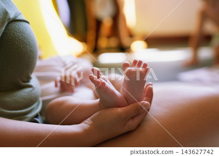 Woman, newborn and feet in home for bonding with love, resting and relaxing or sleep on mother for relationship care. Support, security and trust with family together, motherhood and parent in house Woman, newborn and feet in home for bonding with love, resting and relaxing or sleep on mother for relationship care. Support, security and trust with family together, motherhood and parent in house 143627742