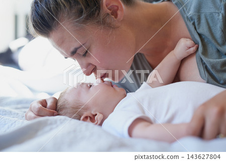 Mom, baby and happy with kiss on bed in home for support, love and care for growth and child development. Parent, kid and happy in bedroom with playing for bonding, childhood memories and toddler Mom, baby and happy with kiss on bed in home for support, love and care for growth and child development. Parent, kid and happy in bedroom with playing for bonding, childhood memories and toddler 143627804