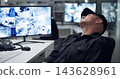 Security guard, computer screen and tired by cctv monitor for protection, data center or building safety. Inspection, video surveillance agency and control room with footage, technology and sleeping 143628961