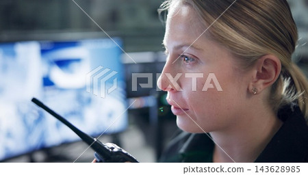 Communication, security and woman with radio, monitor and watch of cctv, danger and control room. Guard, transceiver and working for protection, safety and talking to backup, connection and officer Communication, security and woman with radio, monitor and watch of cctv, danger and control room. Guard, transceiver and working for protection, safety and talking to backup, connection and officer 143628985