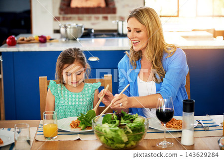 Love, food or mother and daughter in a house for lunch, conversation and bonding with organic meal. Salad, brunch or happy family at home with health, diet and nutrition on vacation, event or weekend 143629284