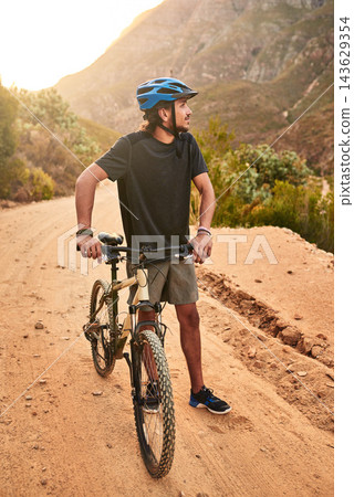Cyclist, thinking and man with bike on mountain for outdoor exercise, journey and training in morning. Fitness, idea and person with bicycle in nature for health, wellness and cycling in Scotland Cyclist, thinking and man with bike on mountain for outdoor exercise, journey and training in morning. Fitness, idea and person with bicycle in nature for health, wellness and cycling in Scotland 143629354