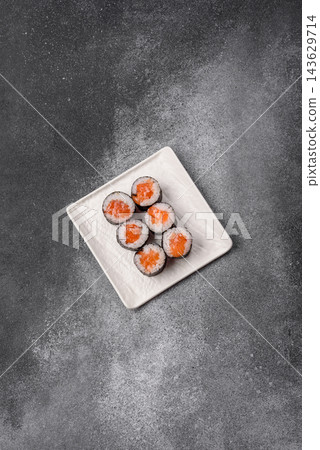 Sushi roll with tuna, rice, and cream cheese, served with soy sauce, wasabi, and ginger. Tuna roll Sushi roll with tuna, rice, and cream cheese, served with soy sauce, wasabi, and ginger. Tuna roll 143629714