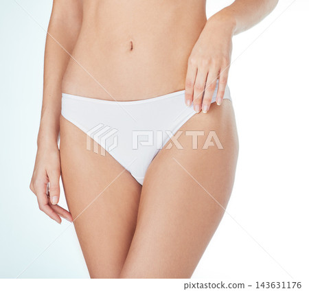 Body, health and woman in underwear closeup in studio for wellness, beauty or lose weight on white background. Panty, stomach detox or girl model with lingerie for glow, skincare and slimming results Body, health and woman in underwear closeup in studio for wellness, beauty or lose weight on white background. Panty, stomach detox or girl model with lingerie for glow, skincare and slimming results 143631176