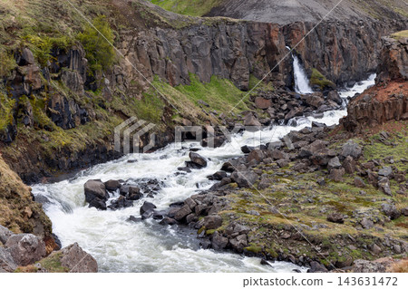 Hengifossa river rapids and waterfall in a rocky gorge in East Iceland in summer Hengifossa river rapids and waterfall in a rocky gorge in East Iceland in summer 143631472